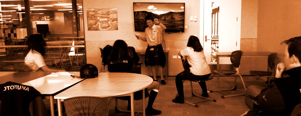 This is a photo of students meeting in a classroom