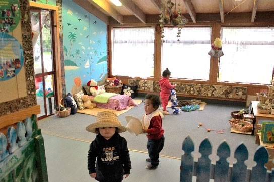 This is a long shot of three children who look happy