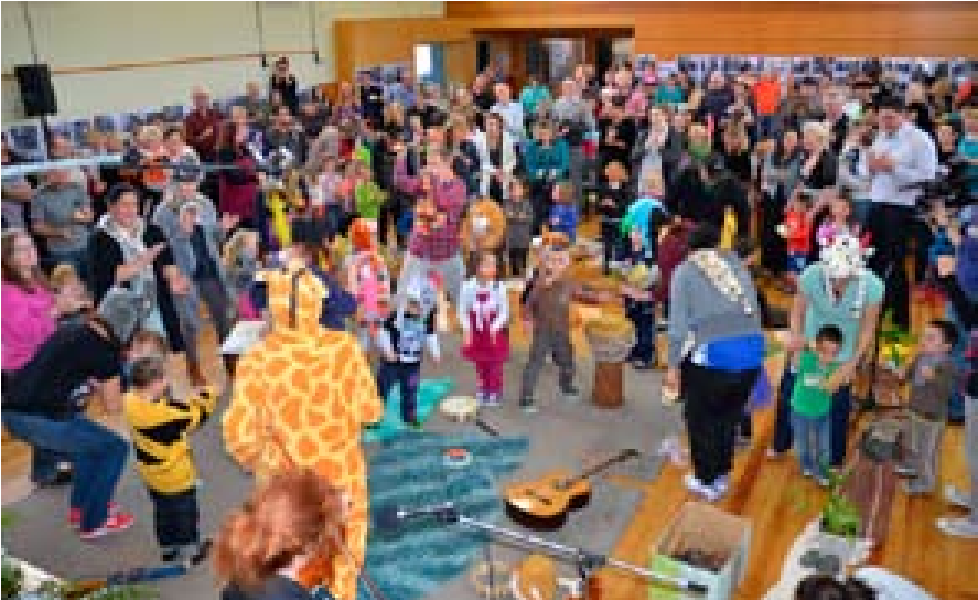 A photo of the crowd and performers in the Helensville Town Hall