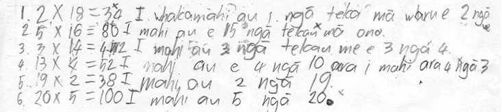 A student's maths workings, with handwritten text in te reo