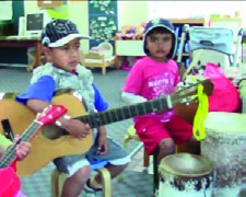 This is a photo of children playing musical instruments