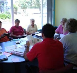 Teachers sitting around a table having a discussion