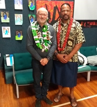 This is a picture of two men. One is pakeha and the other Pasifika