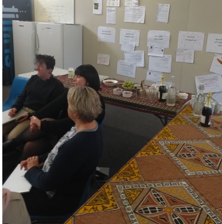 This is a photo of three people sitting at a table