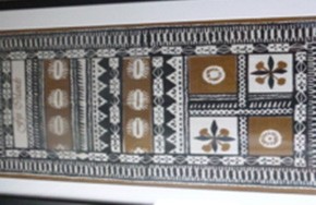 The picture shows a Fijian masi, which is like a tapa cloth. It has traditional patterns and is coloured black, white and brown